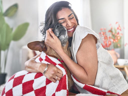 A girl hugging her dog